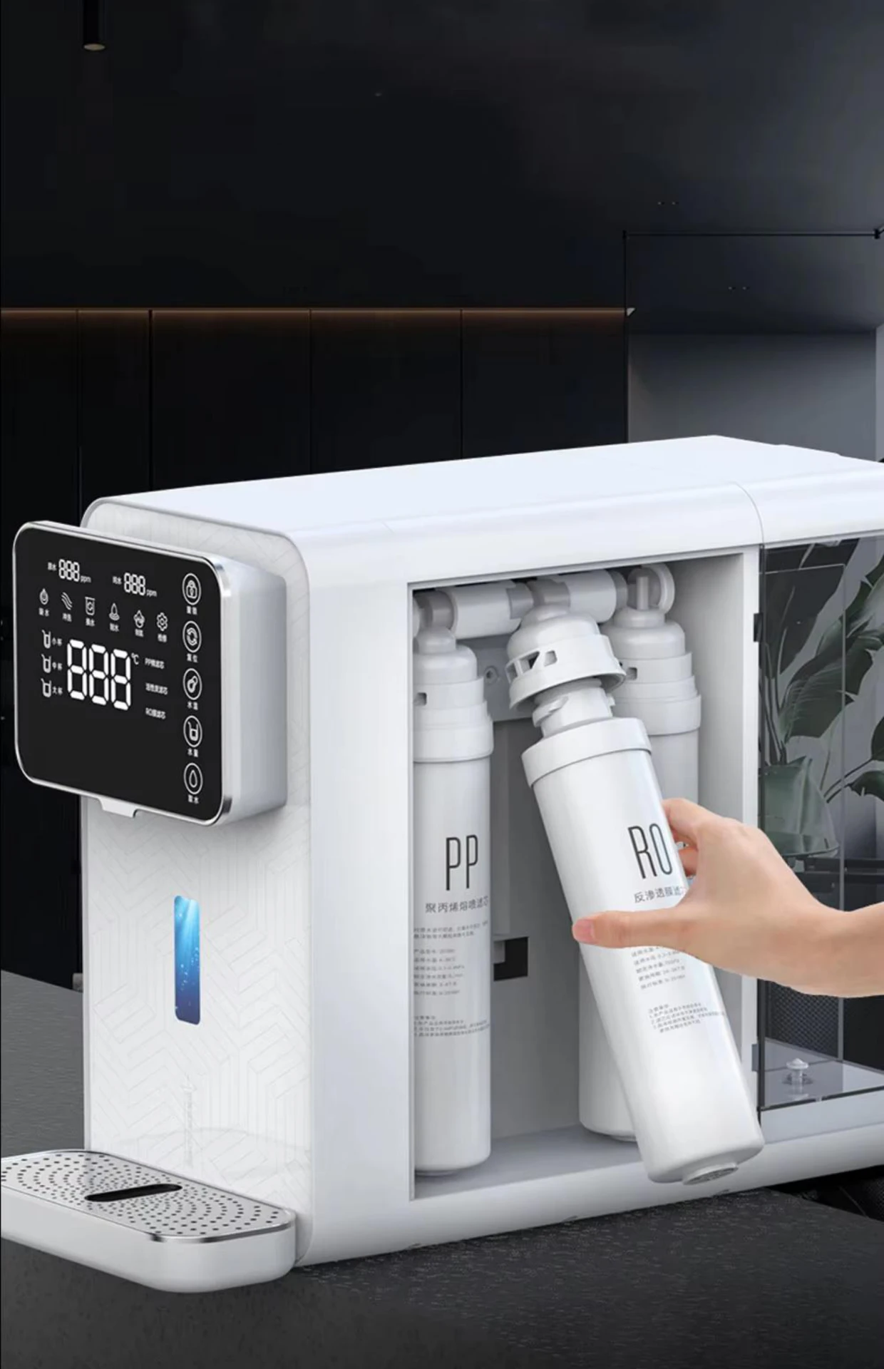 Hand twisting out an RO filter cartridge from the machine's front bay in a tool-free exchange